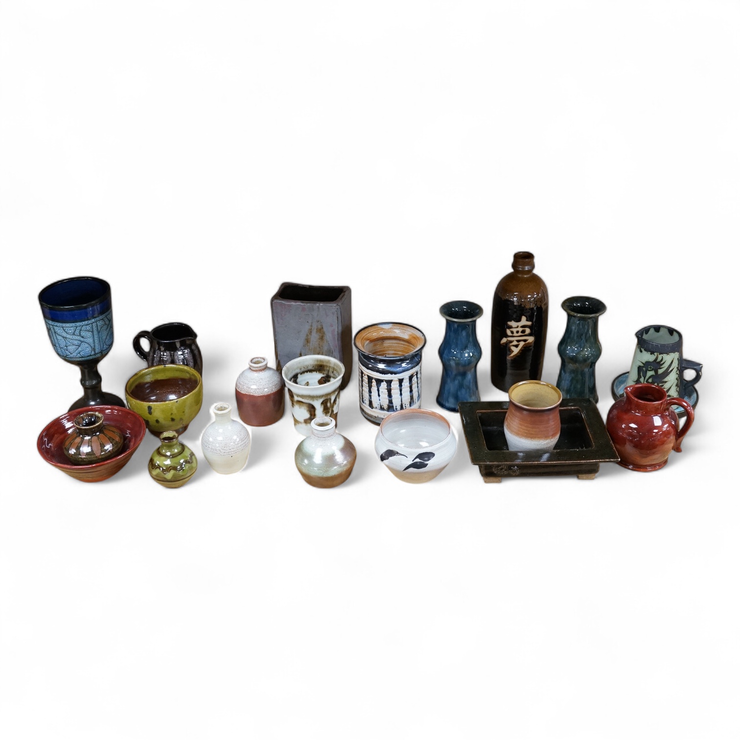 A collection of studio pottery to include a Celtic pottery Newlyn goblet, various jugs and bowls, largest 19cm high